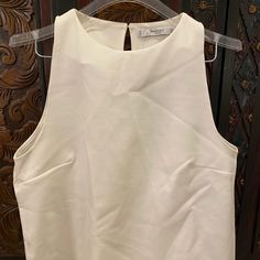 Cute High Neck Sleeveless White Top L Large By Mango. Versatile, Classic Piece - Dress Up Or Dress Down . Thick Material (Not See Through). Make An Offer! White Sleeveless Summer Vest, Chic Sleeveless Vest Top, Sleeveless Vest Halter Top For Spring, Sleeveless Halter Top For Spring, Spring Sleeveless Halter Top, Chic Sleeveless Blouse For Day Out, Chic Sleeveless Summer Vest, Chic Sleeveless Halter Top For Day Out, Sleeveless Denim Vest For Day Out