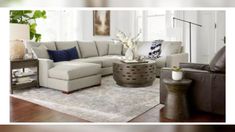 a living room scene with focus on the sectional sofa and coffee table in the center