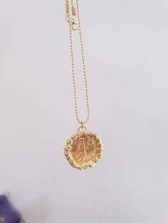 Gold coin necklace, gold pendant necklace, 14k gold necklace, antique coin necklace, medallion necklace, long coin necklace Long 14k gold filled necklace with an antique gold coin pendant, decorated with golden hammered beads. Beautiful minimalist round pendant, designed in an antique style, this gold coin medallion necklace is just a great gift for her It will be your to go necklace, for day or night, never needing to to take it off. Dimensions: The coin medallion pendant diameter is about 0.75 Gold Plated Yellow Gold Medallion Necklace, Gold Medallion Coin Necklace In Brass, Brass Medallion Charm Necklaces, Gold Brass Medallion Coin Necklace, Brass Coin Medallion Necklace, Brass Medallion Coin Necklace, Gold Plated Medallion Necklace, Gold Plated Medallion Locket Necklace, Brass Necklaces With Coin Pendant