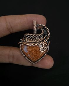 Sunstone Gemstone Pendant Copper Wire Wrapped Pendant Sunstone Pendant Copper Pendant Jewelry Gift For Her Mother Sunstone Jewelry Material :- Copper / Gemstone  Gemstone :- Sunstone  Origin of Stone :- Madagascar                   ----------------------------------A perfect gift ---------------------------------------------------    Necklace Length :- 22  inch  Height :-5 cm Note. it handmade work item it sale many times so stone color of labradorite will be not exact match design will perfect match but i will put best of Snowflake stone in same design my be it similiar color. Copper wire wrapped necklace .  Essentially, wire wrapped jewelry is jewelry that has been created either by wrapping wire around itself or around other elements (cabochons, gemstones, crystals or beads). It's craft Copper Heart Pendant For Jewelry Making, Handmade Copper Heart Pendant Necklace, Handmade Copper Heart Pendant Jewelry, Orange Copper Wire Jewelry As A Gift, Orange Copper Wire Jewelry For Gifts, Earthy Copper Wire Jewelry As Gift, Earthy Copper Wire Jewelry Gift, Bronze-colored Copper Heart-shaped Jewelry, Handmade Rust Copper Wire Jewelry