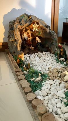 a nativity scene with rocks and trees