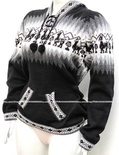 a mannequin wearing a black and white sweater