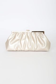 The Lulus Capture the Love Champagne Oversized Clutch can hold more than just the essentials, it can also keep your heart! This flexible faux leather clutch has a slightly metallic finish, a gathered silhouette, and a top clasp closure with gold hardware throughout. Lined interior boasts a sidewall pocket and a detachable gold chain strap. Lined. Clutch Measures 12" Wide, 6. 25" Tall, And 2. 5" Deep Relaxed. Detachable 45" Gold Chain Strap. Strap Has A 22â€ Drop. Shell: 100% Polyurethane. Linin Clutch Aesthetic, Bride Clutch, Nude Bags, Nude Clutch, Prom Purse, Prom Bag, Prom Clutch, Formal Clutch, Prom Inspo