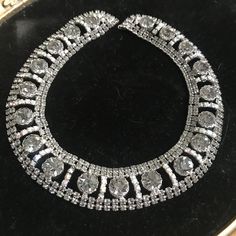 Couture Large Rhinestone Necklace, high end collectible, Choker necklace, Vintage collectible, costume jewelry Rhinestone statement necklace in very good vintage condition.  Measures 15 1/2 inches long by almost 1 inch wide.  Very pretty collectible piece. Perfect for any wardrobe. Nice looking on. ps22 Costume Jewelry Rhinestone Necklace With Metal Jewels, Costume Jewelry Choker With Bling, Costume Jewelry Necklace With Bling, Costume Jewelry Bling Choker, Costume Choker Jewelry With Bling, Costume Jewelry Crystal Necklace With Jewels, Dazzling Metal Necklaces For Formal Events, Party Bridal Necklace With 17 Jewels And Crystal, Metal Rhinestone Necklace With Bling Costume Jewelry