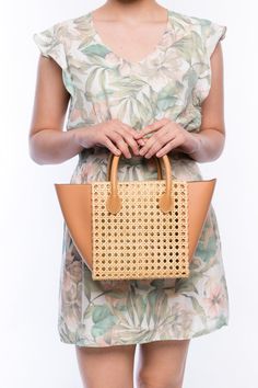 The Honeycomb Solihiya Rattan Bag is the perfect companion for any day, offering timeless style that will complement any outfit, no matter the season. Made from 100% natural rattan, each piece is expertly handwoven by artisans who specialize in traditional rattan weaving techniques. The addition of leather gussets and handles ensures durability, making this bag a lasting investment. With proper care, this classic piece could even be passed down to the next generation. Fully lined with linen fabr Beige Straw Bag With Woven Leather Top Handle, Brown Handwoven Bags For Spring, Spring Handwoven Brown Bags, Open Weave Straw Bag With Top Handle For Shopping, Open Weave Straw Shopping Bag With Top Handle, Top Handle Straw Bag With Open Weave For Shopping, Shopping Straw Bag With Open Weave And Top Handle, Natural Woven Rattan Bag, Chic Woven Rattan Bag