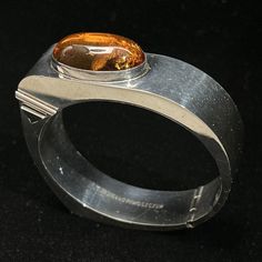 Tomasz Jagiello-Piwoszczuk Sterling Silver Amber Bracelet Poland Modernist Click the link to purchase💰⬇️ #brutalist #bracelet #cuff #modernist #jewelry #vintage #affiliate #ad Luxury Amber Jewelry For Formal Occasions, Designer Hallmarked Jewelry For Collectors, Polished Metal Bracelet Jewelry, Metal Bracelet With Polished Finish, Unique Round Bangle With Polished Finish, Unique Bangle With Polished Finish, Designer Polished Finish Cuff Bracelet As Gift, Unique Round Cuff Bracelet With Polished Finish, Designer Polished Cuff Bracelet As Gift