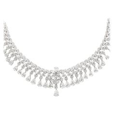 Exquisite vintage diamond layout necklace. 29.58 carats of round brilliant, pear, and marquise cut diamonds. Approximately G/H color and VS2/SI1 clarity. 18k white gold, 16in. Accommodated with an up-to-date appraisal by a GIA G.G. once purchased, upon request. Please contact us with any questions. Item Number N6389 Modern Diamond Jewelry, Bridal Diamond Necklace, Drop Necklaces, Diamond Drop Necklace, Pearl Drop Necklace, Diamond Tennis Necklace, Round Necklace, Royal Jewels, Expensive Jewelry