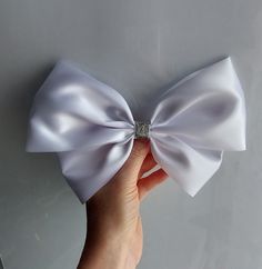 White and silver detachable satin ribbon bow Bow Measures 23 cm and 15 cm approx., please check measurements to make sure size suits your needs.  Bow is attached to small brooch pin for easy attaching Satin Ribbon Bow, Satin Ribbon, White Silver, Dress With Bow, Dress Clothes For Women, Brooch Pin, Ribbon, Satin, Arts And Crafts