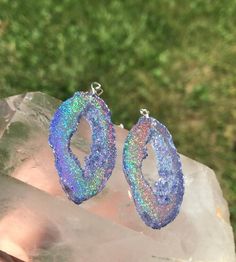 These purple holographic color shifting geode earrings are sure to get compliments or make an amazing one of a kind gift! They are mostly a clear purple at a certain angle and then as soon as they shift they show a beautiful sparkly rainbow. They are lightweight and won't bother your ears. For those who want all the sparkle but in a smaller geode stud, these are also available! https://www.etsy.com/listing/1180059919/holographic-gem-studs Matching necklaces available, link below https://www.etsy Affordable Hypoallergenic Iridescent Earrings, Cheap Iridescent Earrings For Party, Cheap Multicolor Crystal Earrings For Gift, Holographic Color, Purple Holographic, Boho Chic Earrings, Geode Earrings, Long Tassel Earrings, Diy Resin Crafts