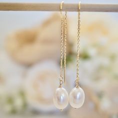 These dainty pearl drop earrings feature lustrous genuine freshwater pearl gemstones, suspended on a delicate chain creating a thread through earrings that is unique and eye catching. Threader earrings are lightweight earrings, which consist of a delicate chain that threads through the earlobe, showcasing the stunning pearls suspended in mid -air for a mesmerizing effect. These pearl earrings are perfect to pair with your summer dresses or wedding guest dresses. Details:---------- - lustrous gen Delicate Pearl Earrings With Adjustable Chain, Everyday White Pearl Drop Threader Earrings, Delicate Pearl Chain Earrings, 14k Gold Filled Pearl White Dangle Pearl Earrings, White Pearl Drop Threader Earrings, Adjustable Dangle Pearl Earrings With Pearl Chain, Adjustable Dainty Pearl Earrings, Adjustable Dangle Pearl Chain Earrings, Delicate Pearl Chain Dangle Earrings