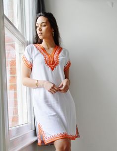 ooooooooooooooooooooooo A great spring/summer piece from Maison de Marrakech. We have combined the unique Moroccan embroidery technique into our own 'bohemian romantic' designs. It's stunning on its own, or you can wear this beauty with boho accessories, or simple elegant accessories, and will look just FAB. It's elegant, yet casual, not to mention the exotic embroidery, which brings out the uniqueness of this beautiful tunic dress. Wow your friends this summer, it's 100% handmade, and cannot be Ethiopian Clothing, Moroccan Clothing, Moroccan Dress, Holiday Wear, Autumn Dress, African Design Dresses, Tunic Styles, African Dress, Spring Dresses