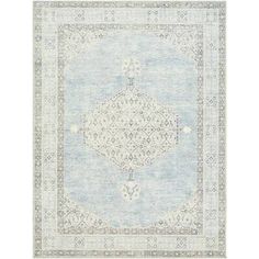 a light blue and white rug with an ornate design