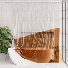 a bath tub sitting next to a potted plant