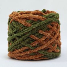 a spool of green and brown yarn