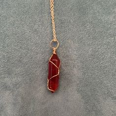 New Beautiful Red Crystal In Gold Wire Cage With 20 Inch Gold Adjustable Chain. Red Bohemian Crystal Necklace As Gift, Red Bohemian Crystal Necklace For Gift, Red Bohemian Pendant Crystal Necklace, Bohemian Red Crystal Pendant Necklace, Bohemian Red Pendant Crystal Necklace, Spiritual Red Metal Necklace, Adjustable Wire Wrapped Red Jewelry, Adjustable Red Wire Wrapped Jewelry, Red Wire Wrapped Pendant Necklace