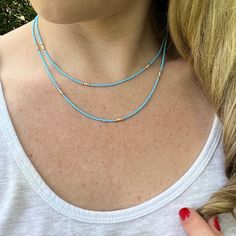 Dainty Layered Beaded Necklace with Blue and Beige/White Czech Glass Beads. Super Lightweight! Beads: * Blue Czech Glass - 1mm * Beige Seed Beads - 2mm * 10K Gold Spacer Beads - 2mm Clasp: *10K Gold Plated Lobster Claw Clasp  * The model in the pictures is wearing 16 & 18 inches.  Choose your Lengths at Checkout! If you don't see a certain length in the drop down menu, please message me with the lengths you would like :)  To view more of my original jewelry designs, visit: https://www.etsy.com/s Sead Bead Necklace, Layered Beaded Necklace, Beachy Necklace, Layered Beaded Necklaces, Original Jewelry Design, Beach Necklace, Necklace Layered, Beach Necklaces, Bohemian Necklace