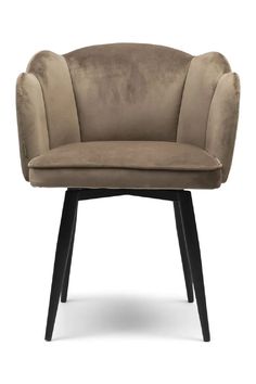 an upholstered chair with black legs and a light brown velvet seat, on a white background