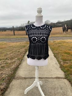 "Black Lacy Crochet Tank Top.  Great with a camisole underneath or as a bathing suit coverup.  Looks great with jean, shorts, or a skirt.   Bust 34\", length 19 in.  Approximate size M  Custom order - message me with color Custom Orders usually take about 2-3 weeks to create (not including shipping time). However, depending on the number of orders I have, it could take more or less time to make the item and ship it to you. If you need it by a certain day, feel free to message me and I can let you know if that will be possible!Dress form used is a size medium." Summer Beach Lace Top Fitted, Fitted Lace Top For Beach, Summer, Fitted Lace Top For Summer Beach, Hippie Crochet Top For Beach Season, Beachwear Lace Tops For Beach Season, Lace Beachwear Tops For Beach Season, Bohemian Stretch Cover-up For Festivals, Hippie Sleeveless Crochet Top For Beach, Sleeveless Crochet Lace Top For Beach Cover-up