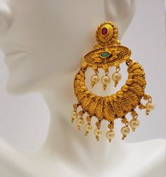 This beautiful earrings set has an excellent finish and gives out an exquisite sense of style. If you are looking for an amazing Fashion Jewelry set for special occasions such as Anniversary, Engagement, Party, Wedding, or for gifting, then your search ends here. Handmade Indian Temple Jewelry, best to wear it for traditional ceremonies or Indian wedding. This bridal jewelry has an ethnic finish. It has Cubic Zircon stones with semi-precious ruby and emeralds. It is a Bollywood style one gram je 22k Gold Danglers For Wedding And Diwali, 22k Gold Wedding Danglers For Diwali, Wedding Chandbali Danglers In 22k Gold, 22k Gold Chandbali Wedding Danglers, 22k Gold Chandelier Earrings With Intricate Design For Wedding, Bollywood Style 22k Gold Wedding Earrings, Wedding Chandelier Earrings In 22k Gold With Intricate Design, Wedding Temple Jewelry Chandelier Earrings In Yellow Gold, Gold Chandelier Earrings With Latkans For Wedding