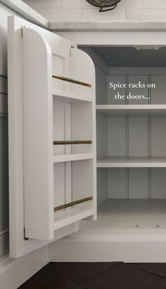 an empty white pantry with shelves and cupboards on each side that says spice racks on the doors