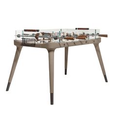 a table that has some kind of machine on it's legs in front of a white background