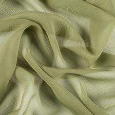 Mood's Premium Pesto Silk Crinkled Chiffon is a sheer, lightweight and ethereal fabric with a subtle, crinkled texture. An excellent choice for fluid, top-weight garments, overlays, flowing scarves, and sheer insets such as ruffle details and draped extensions. 

Note: Dye lots are subject to change up to 10% in either direction. Ordering swatches is HIGHLY recommended for these products. Luxury Flowy Silk Chiffon Dress, Stretch Chiffon Fabric, Cotton Silk Clothing Fabric, Luxury Silk Chiffon Dress, Luxury Sheer Fitted Tulle Fabric, Luxury Sheer Chiffon Dress For Wedding, Luxury Elegant Summer Tulle Fabric, Chiffon Swatch Fabric, Tan Chiffon Fabric