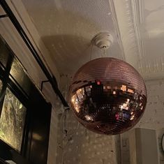 a disco ball hanging from the ceiling in a room