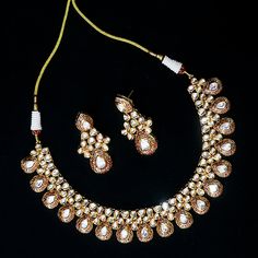 Exotic and snag-free kundan beaded necklace set with earrings. This is a stylish set with White Kundan. This set will work well with traditional, formal, and western formals. Eye-catching and unique jewelry that will set you apart. Gift this piece to a loved one, and see their face light up with joy. Best for gifting or for personal use, wear it to any occasion and become the spotlight. Option 1 : White (D536) Option 2 : Red & Green (D537) Red Traditional Kundan Necklace For Festivals, Diwali Festive Gold-plated Kundan Necklace, Traditional Red Kundan Necklace Handmade, Festive Red Kundan Necklace, Western Formals, Elegant Red Kundan Gold-plated Necklace, Necklace Set With Earrings, Silver Pooja Items, Glass Bangles