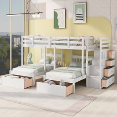 two bunk beds with drawers underneath them in a room that has yellow walls and hardwood floors