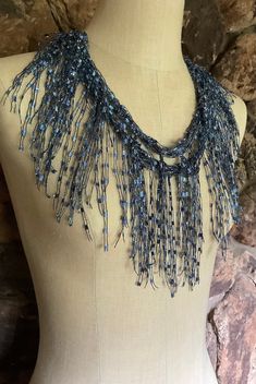 "Denim scarf necklace for women. Light scarf for warmer climates all year around, very cool to wear. Denim jewelry accessory to dress up jeans jacket or wear with white T-shirt and jeans. This scarf is medium blue with sparkly silver metallic accent. Glistens like jewelry, looks almost like beads but without the weight. There is another one like this but it has more dark blue in it, this is more same solid medium blue.  Ideal for travel, fits right in your purse. Wear with your favorite pendant or necklace to add more bling (necklace in the pictures doesn't come with the scarf). Fold it in half and put ends thru the loop behind your neck and you have nice bib collar or do the same at front and have tied up scarf look or let it hang straight down as long scarf. This is not an infinity scarf Scarf Jewelry Artful Home, Denim Crocheted Scarf, Trendy Blue Scarves For Gifts, Trendy Blue Scarf As Gift, Trendy Blue Scarf For Gift, Blue Festival Scarf, Elegant Handmade Blue Scarves, Handmade Blue Casual Scarves, Casual Handmade Blue Scarves