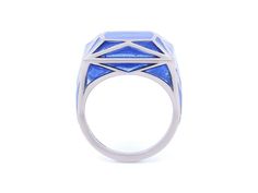 Blue plique-à-jour enamel ring in 18K white gold. Signed SA-P for Solange Azagury-Partridge, with English hallmarks. The retail price is £5800 (approximately $7500). Plique-à-jour is a difficult enameling process in which enamel is applied to an area with no backing instead of onto metal. The result is the enamel is transparent or translucent. Modern White Gold Rings With Enamel, Modern Enamel Rings For Formal Occasions, Luxury Enamel Ring With Polished Finish, Blue Enamel Fine Jewelry Ring, Blue Enamel Ring Fine Jewelry, Blue Enamel Ring In Fine Jewelry Style, White Gold Enamel Rings With Polished Finish, Blue Polished Enamel Ring, Blue Enamel Polished Round Ring