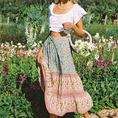 This stunning boho maxi skirt is perfect for the free-spirited fashionista. Its flowy design and colorful floral print make it a must-have for any bohemian wardrobe. Embrace your inner free spirit with this versatile and stylish skirt. Bohemian Wardrobe, Boho Maxi Skirt, Maxi Skirt Boho, Flowy Design, Stylish Skirts, Boho Skirts, Boho Maxi, Free Spirited, Free Spirit