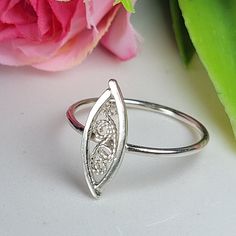 Filigree ring made by intricate metal work, creating a rich floral and dainty look. The sterling silver leaf ring is inspired by Art nouveau jewelry combined with modern design. This oval art ring is perfect for a beloved woman, and as a pampering gift for yourself. The ring is very flattering to the finger, comfortable to wear as a jewel for everyday use and impressive as a jewel for a special occasion. The structure of the ring is  approximately 12 mm long, creating an elegant and unique style. The ring is made of 925 sterling silver by hand tools only. Each piece of jewelry is handmade to order, therefor due to the special nature of handcrafting, there may be slight differences compared to the jewelry in the photos shown. This adds to the charm and individuality of each piece, making it Elegant Oval Sterling Silver Midi Rings, Elegant Oval Midi Rings In Sterling Silver, Dainty Silver Engraved Oval Ring, Delicate Oval Sterling Silver Rings, Adjustable Sterling Silver Oval Filigree Ring, Adjustable Oval Sterling Silver Filigree Ring, Sterling Silver Filigree Toe Ring, Handmade Open Filigree Ring For Promise, Filigrana Jewelry