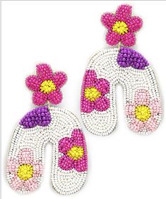 pair of pink and yellow beaded earrings with flowers on the front, two side by side