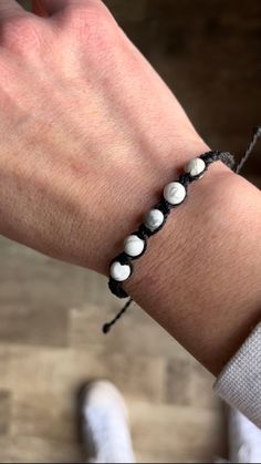 This bracelet has 5 round howlite beads surrounded by square knots on Brazilian waxed cord. It adjusts to fit most from 6 inches inches to 9.5inches.  Howlite is a great grounding stone. It is all about peace, calming patience and a newfound perspective. Perfect for those times of tumultuous emotions and you need to simply calm that sh*t. Adjustable Howlite Beaded Bracelets With Round Beads, Adjustable Howlite Beaded Bracelets, Square Knot, Bracelet Black, Braided Bracelets, Beaded Bracelet, Friendship Bracelets, 6 Inches, Jewelry Bracelets