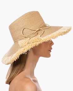 If you are looking for a woman's sun hat for sale online that is sure to turn heads, look no further! Named from the Caribbean Island that has endless beaches and warm turquoise water, this sun hat made of Squishee®, is a show stopper. This flirty, tropical sun hat combines the pinched crown of a fedora with a wide brim, edged all around with glamorous straw fringe. Wherever you adventure, from St. Barths to Antibes, approving smiles are sure to follow! Squishee® straw is a sustainable man-made Tropical Sun, Hat Fedora, St Barths, Straw Fedora Hat, Caribbean Island, Straw Fedora, Wide Brim Fedora, Turquoise Water, Caribbean Islands