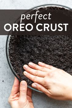 two hands reaching for oreo crust in a glass bowl with the words perfect oreo crust above it