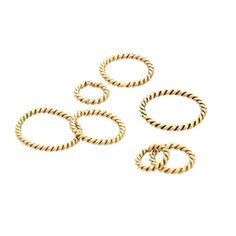 four gold rings on a white background