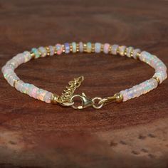 Opal Beaded Bracelets As Gift, Opal Gemstone Bracelet Jewelry, Opal Beaded Bracelets For Gifts, Opal Bead Bracelet, Opal Gemstone Beads Bracelets, Adjustable Opal Rondelle Jewelry, Beaded Opal Bracelets, Opal Bracelet Vintage, Hand-strung Opal Rondelle Jewelry