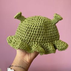 By VERY popular demand, I introduce to you the cutest little Shrek hat you've EVER SEEN! Handmade crochet Shrek hat for babies aged from 0-6 months ish, or a little older as there's plenty of stretch in the material. Made using super soft acrylic yarn which is gentle on your baby's skin, and can be washed on a low heat with your usual washing. Can be made in any 3 of the Shrek-ky green shades, perfect gift for Shrek loving parents! Cute One Size Hat, Adjustable Whimsical Hats For Playtime, Whimsical Adjustable Hats For Playtime, Adjustable Green Hat For Playtime, Cute Crochet Hat With Curved Brim, Playful Adjustable Crochet Hat, Cute Adjustable Yarn Mini Hats, Adjustable Playful Yarn Hats, Green Adjustable Crochet Beanie