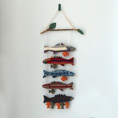 a group of fish hanging on a wall