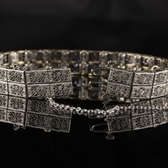 Beautiful antique diamond and sapphire bracelet. Item #B0022 Metal: 14K White Gold Weight: 24.9 Grams Total Diamond Weight: Approximately 0.20 cts Diamond Color: H Diamond Clarity: SI1 Total Sapphire Weight: Approximately Approximately 0.50 cts Measurements: 7.5 x 0.7 in Layaway: For your convenience, we will be happy to provide layaway payment options. Please contact us to work out a layaway plan which best suits your needs. All layaway purchases are final sale. All domestic and international s Wedding Band Engraving, Engraved Wedding, Emerald Engagement, Gold Engraving, Sapphire Bracelet, Antique Art Deco, Antique Diamond, Diamond Cluster Ring, Emerald Engagement Ring