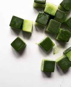 chopped up green vegetables sitting on top of a cutting board