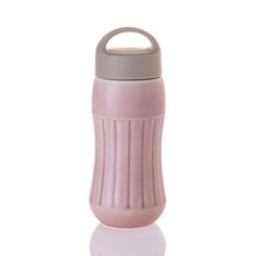 thermos bottle is pink and grey with a handle on it's side