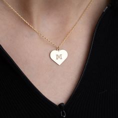 💖 Welcome to our collection of timeless elegance and personalized charm! Our Gold Heart Initial Necklace is a heartfelt tribute to individuality and love. ✨ Each necklace features a delicate 14K solid gold chain adorned with a dainty heart pendant, expertly engraved with your chosen initial. 🎁 Versatile and enduring, this necklace is an ideal gift for any occasion. Celebrate Mother's Day with a thoughtful token of appreciation, surprise a friend on their birthday with a personalized touch, or Personalized 14k Gold Initial Necklace For Anniversary, Classic Initial Necklace For Anniversary And Mother's Day, Elegant Heart Pendant Necklace With Hallmarks, 14k Gold Heart Necklace With Hallmarks, 14k Gold Charm Necklace For Anniversary, Personalized Heart Initial Necklace For Anniversary, Classic Charm Necklaces For Mother's Day Personalized Gift, Personalized Heart Initial Necklace For Anniversary Gift, Classic White Gold Charm Necklaces For Anniversary