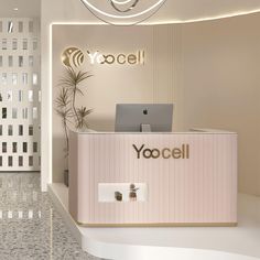 the front desk of yocell is lit up with lights and plants in it