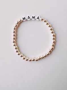 Meet our new Gold Beaded Mama Bracelet! Perfect for embracing motherhood in style! Great gift for moms and mom figures in your life! Mama Bracelet, Great Gifts For Mom, Twin Quilt, Knitted Throws, Cards Sign, Gold Beads, Running Women, Hats For Men, In Style