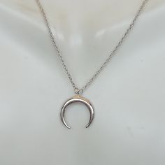 A Sterling silver neck chain with a crescent moon charm. Dimensions: 14.5 x 15.5 mm Length: 16 to 17 inches This necklace is made of 925 hypoallergenic sterling silver. Most of my pieces come with a 925 stamp. Please go through all the pictures posted for this item to gauge the actual size. Can be packaged in a gift box. I can include a personal message from you if needed You are welcome to contact me at... bhavnakwintra1956@gmail.com For more beautiful pieces from my shop, please browse 👇 SILV Silver Crescent Sterling Silver Charm Necklace, Silver Crescent Moon Phase Charm Necklace, Silver Dainty Moon Charm Necklace, Dainty Silver Necklace With Moon Charm, Minimalist Crescent Moon Phase Charm Necklace, Silver Crescent Charm Necklace, Minimalist Silver Moon Charm Necklaces, Minimalist Silver Moon Necklace, Silver Crescent Charm Necklace For Everyday Wear