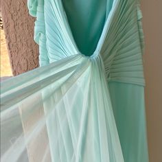 This Dress Is Seafoam Green. The Front Is Embellished With Rhinestones And Crosses In The Back. The Back Has A Train That Flows In The Wind. Simple, Beautiful Color, Elegant That Is Perfect For Any Formal Out Door Event. This Gown Has Never Been Used! This Dress Is High Quality With Beading. Grey Homecoming Dress, Illusion Dress Prom, Metallic Prom Dresses, Silver Prom Dress, Missy Dresses, Formal Cocktail Party, Sequin Formal Dress, Prom Dresses Gowns, Blue Dress Formal