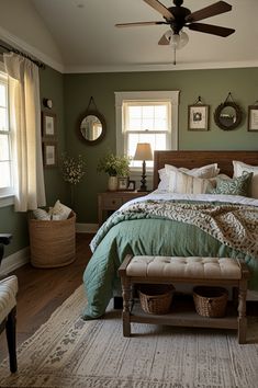 a bedroom with green walls and wooden furniture, including a bed covered in blankets and pillows